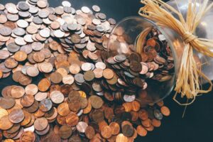 picture of saving coins in the article "is saving money worth it?"